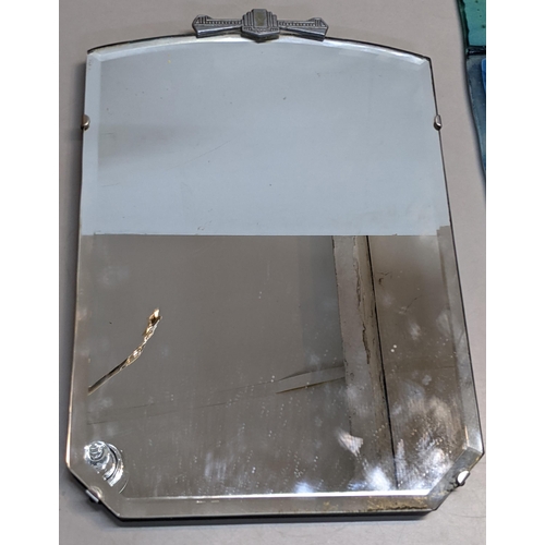 520 - An Art Deco frameless mirror having a chrome Deco detail to the top, 38cm h x 25cm w
Location: A3F