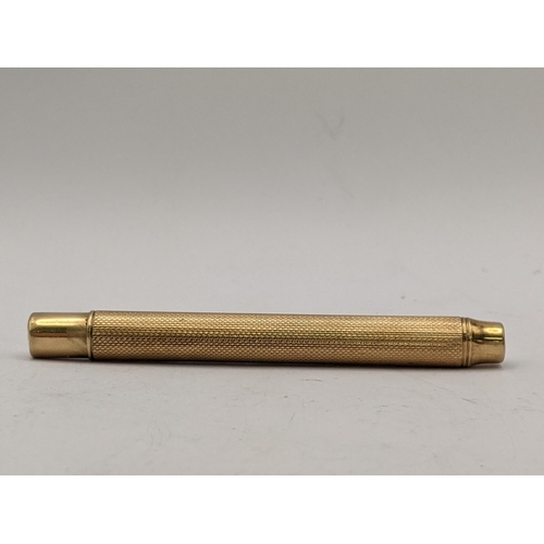 97 - A 9ct gold propelling pencil, marked 375 probably London  1937 (gross weight 19.9g)
Location: CAB1