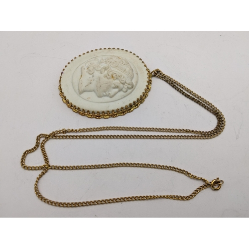 98 - A yellow metal chain, clip and circular surround set with a Meissen porcelain tablet with a side por... 