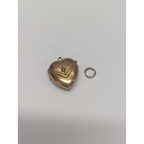 106 - A 9ct gold heart shaped pendant locket, inset with sea of pearl A/F 
Location: CAB1