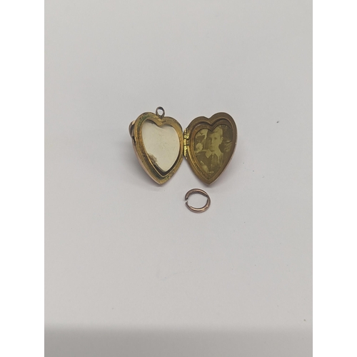 106 - A 9ct gold heart shaped pendant locket, inset with sea of pearl A/F 
Location: CAB1