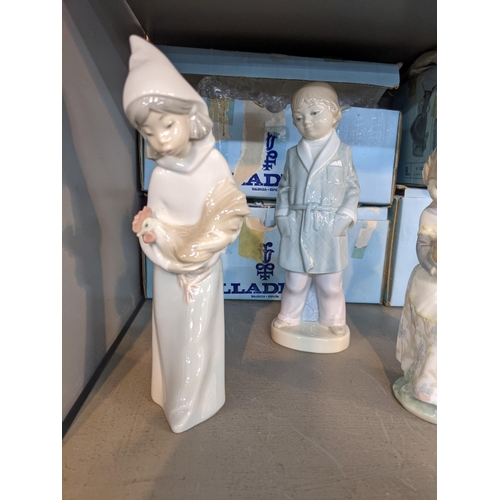 167 - Six Lladro figures to include a girl holding a chicken, a girl holding a basket of oranges, a boy in... 