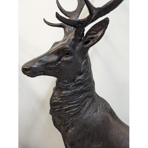 192 - After Jules Moizniez - a pair of late 20th century patinated bronze models of stags  on marble plint... 