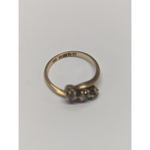 173 - An 18ct gold twist ring, inset with three diamonds, size N½,2.9
Location: CAB3