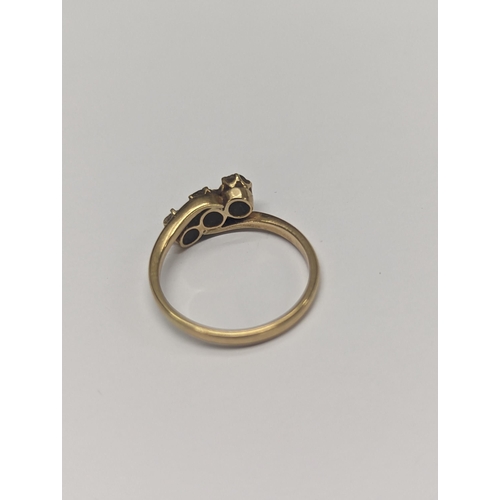 173 - An 18ct gold twist ring, inset with three diamonds, size N½,2.9
Location: CAB3