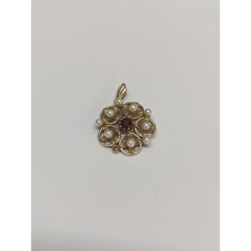 174 - A 9ct gold pendant A/F inset with central garnet and nine pearls in a floral design 4.5g
Location: C... 