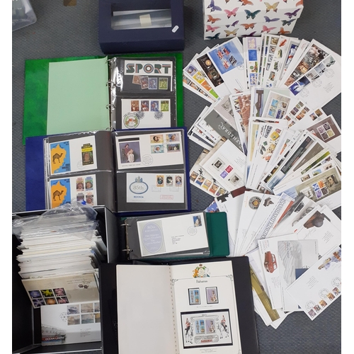 94 - A quantity of first day covers housed in 1 box and 4 albums dating 1980's-2008 to include commemorat... 