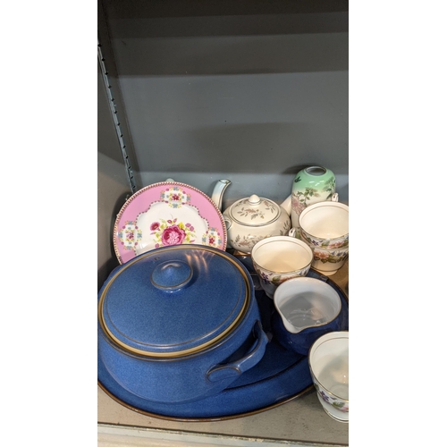 127 - A mixed lot to include pottery items a Denby blue treen, platter and mug, along with terracotta dess... 