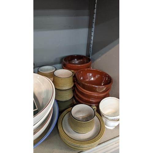 127 - A mixed lot to include pottery items a Denby blue treen, platter and mug, along with terracotta dess... 