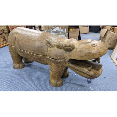 149 - A large moulded sculpture model of a hippo, 43cm h x 98.5cm w
Location:A1M