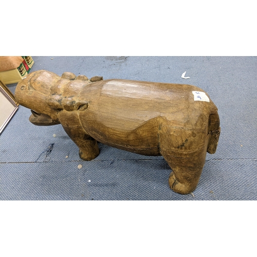 149 - A large moulded sculpture model of a hippo, 43cm h x 98.5cm w
Location:A1M