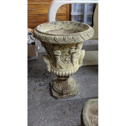 153 - A pair of lightly weathered garden pedestal urns, classical figurative decoration cast in relief wit... 