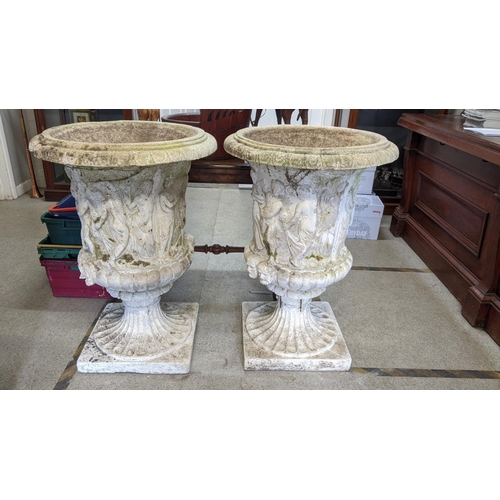 154 - A pair of large garden urn planters in the Neo Classical design having egg and dart border above mou... 