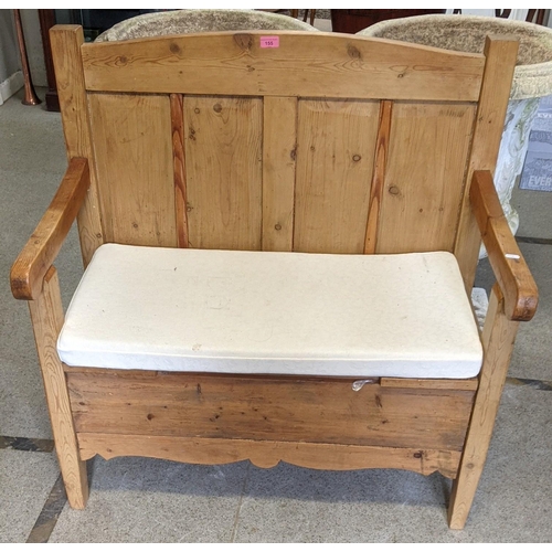 155 - A small pine pew having a panelled back and on tapering block shaped legs, 101.5cm h x 95.5cm w
Loca... 