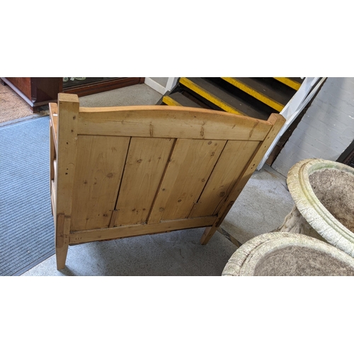 155 - A small pine pew having a panelled back and on tapering block shaped legs, 101.5cm h x 95.5cm w
Loca... 