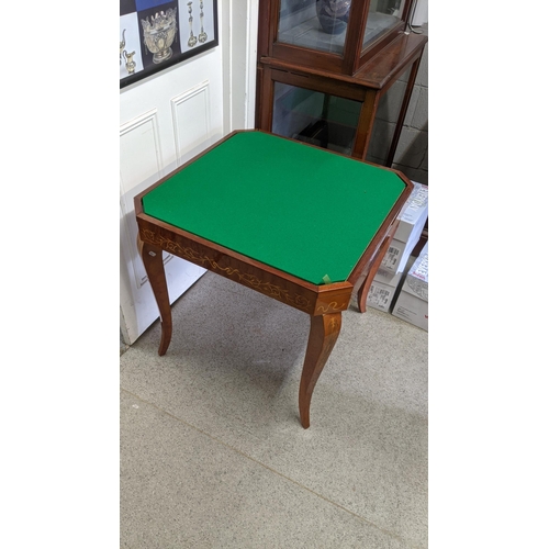 159 - A Sorrento parquetry inlaid games table having removeable top with changeable game tops 75cm h x 77c... 