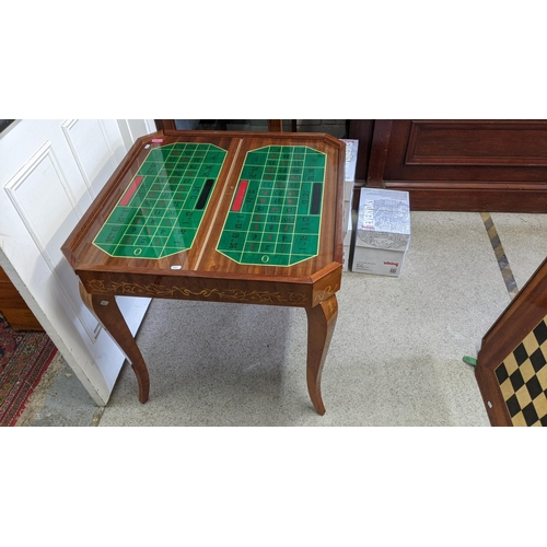 159 - A Sorrento parquetry inlaid games table having removeable top with changeable game tops 75cm h x 77c... 