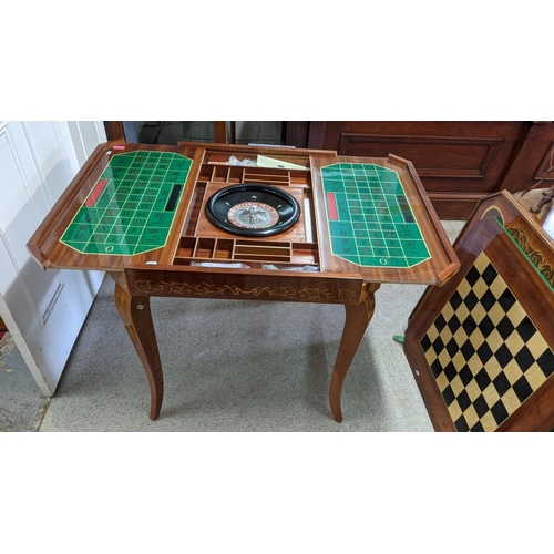 159 - A Sorrento parquetry inlaid games table having removeable top with changeable game tops 75cm h x 77c... 