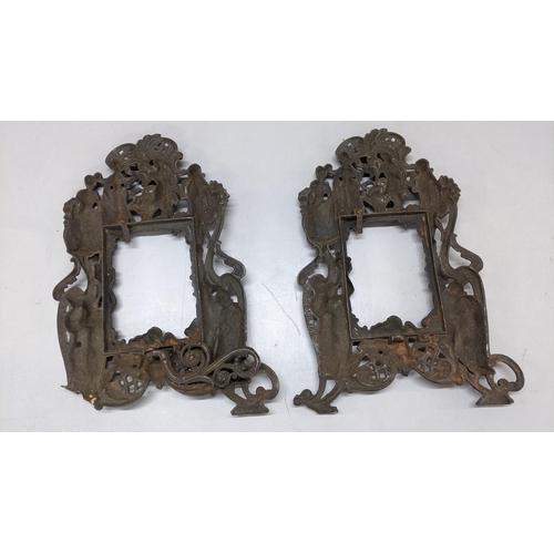 178 - A pair of Victorian wrought iron photograph frames ornately decorated with figures and cherubs
Locat... 