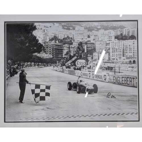 18 - A black and white reprinted photograph of Stirling Moss in a car, signed
Location:RWM