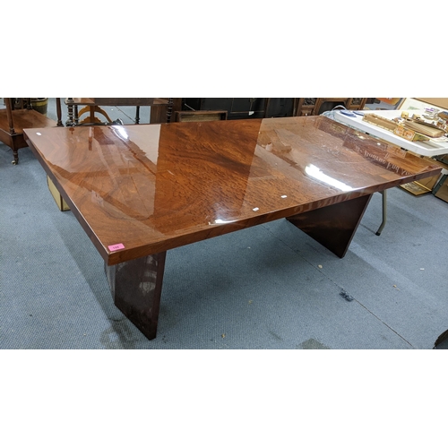 186 - A modern walnut finished rectangular dining table supported by two pedestals, 71cm h x 195cm w
Locat... 