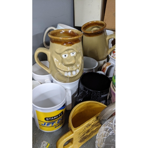 195 - A mixed lot to include various mug including Wallace and Gromit character and others together with m... 