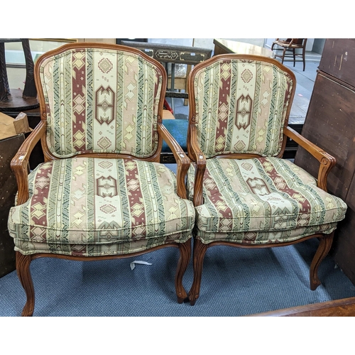 206 - A pair of French style walnut armchairs standing on cabriole legs Location:A3B