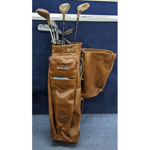 213 - A collection of vintage Technique golf clubs contained in a Dominion leather golf bag Location:RWB