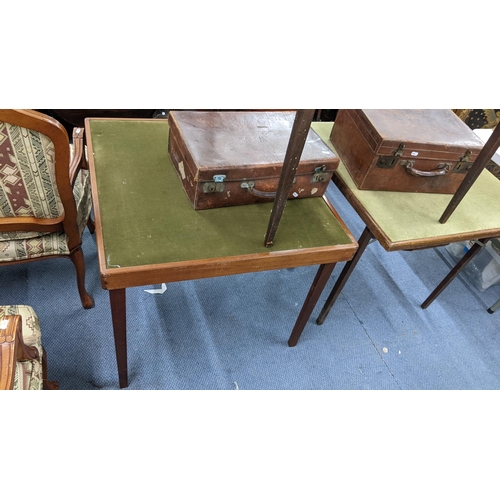 218 - Three early 20th century folding card tables, together with two brown leather cases Location:A3M