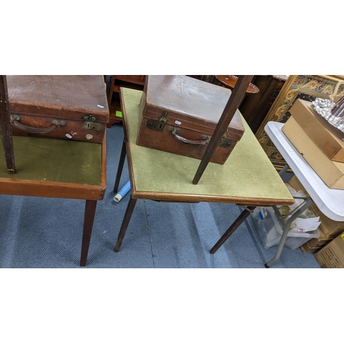 218 - Three early 20th century folding card tables, together with two brown leather cases Location:A3M