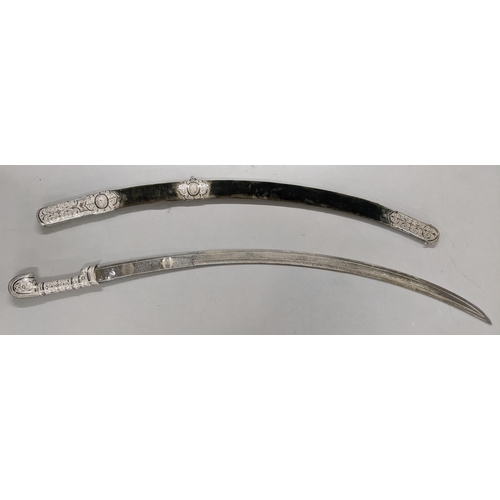 222 - A late 19th/early 20th century Shaska sabre presentation style with a white metal mounted scabbard, ... 