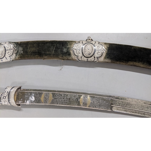 222 - A late 19th/early 20th century Shaska sabre presentation style with a white metal mounted scabbard, ... 