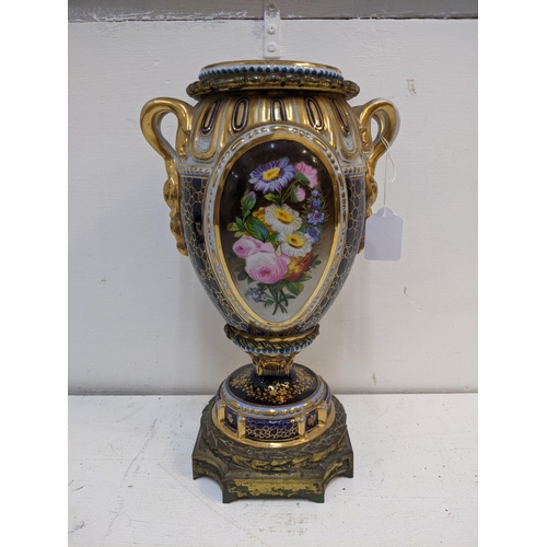 273 - A 19th century porcelain and gilt metal vase and cover decorated with panels of flowers and figures ... 