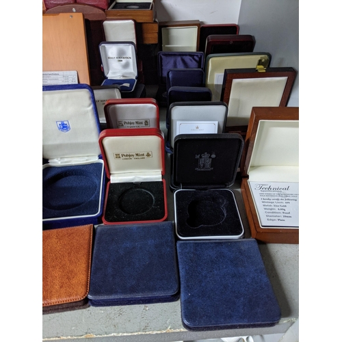 31 - A collection of empty wooden and other coin cases
Location:G