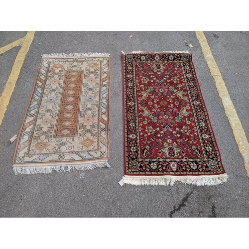 32 - A Turkish milash rug with an abstract design with central orange oblong with nine repeating gulls on... 