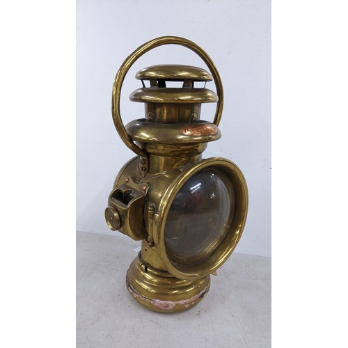 394 - An early 20th century Salsbury London brass vehicle lamp
Location: 5.1