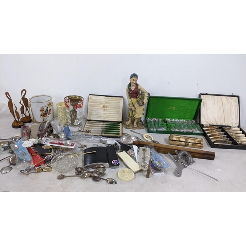 403 - A mixed lot to include a camel bone trinket box boxed and loose collectors spoons, trench art silver... 