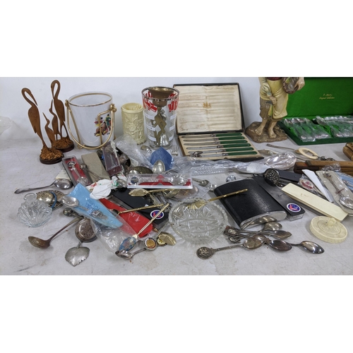 403 - A mixed lot to include a camel bone trinket box boxed and loose collectors spoons, trench art silver... 