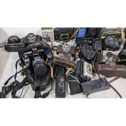 408 - Mixed cameras and accessories to include a Minolta 7000, Exakta, Olympus and others
Location: A1B