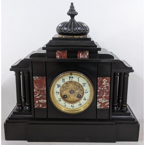 409 - A late Victorian black slate mantle clock of architectural form and striking on a gong
Location: 1.1