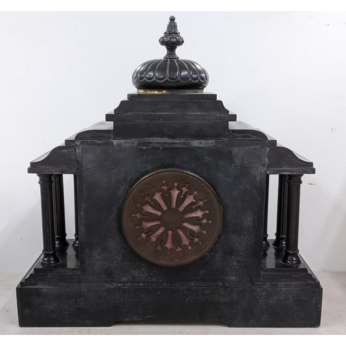 409 - A late Victorian black slate mantle clock of architectural form and striking on a gong
Location: 1.1