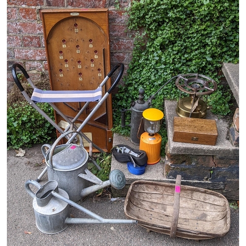 417 - A mixed lot to include early 20th century galvanised watering cans, kumbokatel  board and other item... 