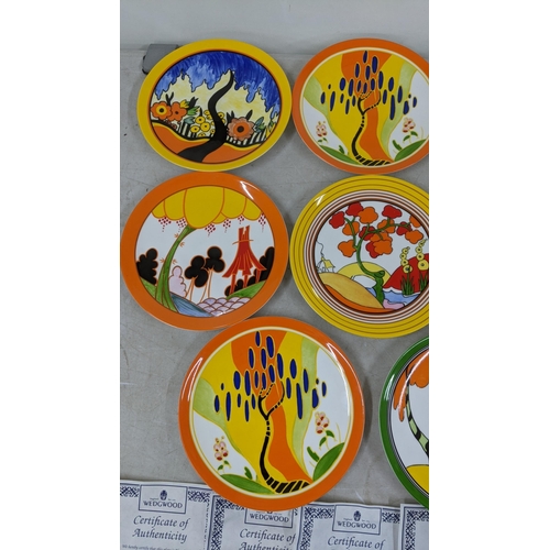 66 - A small collection of Wedgwood - Clarice Cliff collectors plates along with certificate of authentic... 