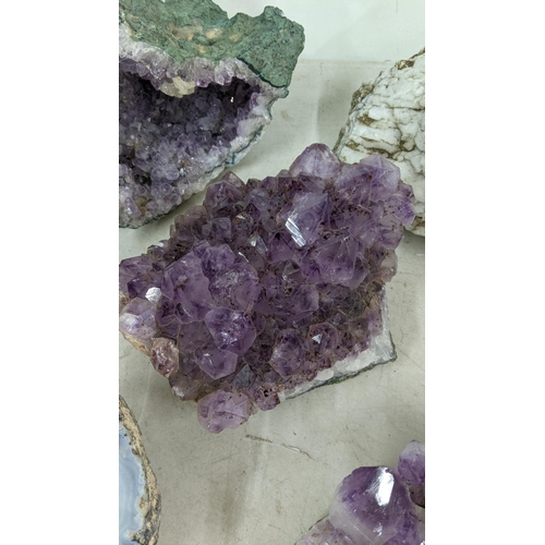 72 - Three large purple amethyst clusters, approx 12cm h x 18cm w, 9.5cm h x 18cm w, 7cm h x 17cm w toget... 