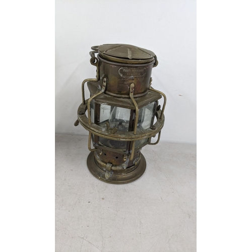 75 - Two early 20th century ship lanterns to include a Robb Moone and Neil together with a Franx Schibeac... 