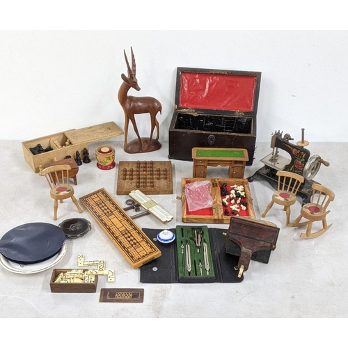 76 - A mixed lot of Victorian and later games to include a bone Domino set along with a Solitaire board a... 