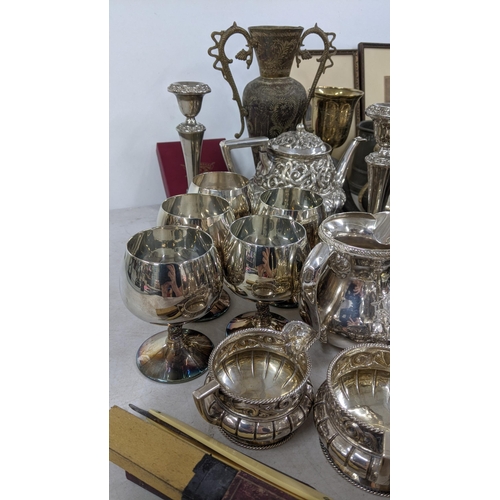 77 - A mixed lot of silver plated items to include a pair of silver plated goblets, a tea pot milk jug, s... 