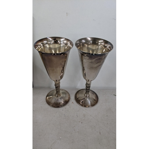 77 - A mixed lot of silver plated items to include a pair of silver plated goblets, a tea pot milk jug, s... 