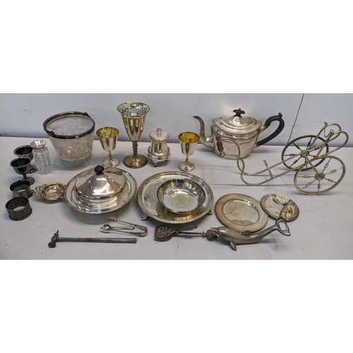 87 - A mixed lot of silver plate to include a muffin dish, napkin rings, teapot and other items together ... 