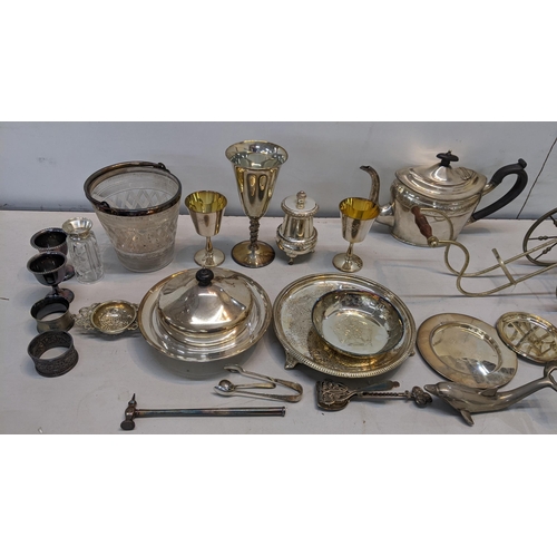 87 - A mixed lot of silver plate to include a muffin dish, napkin rings, teapot and other items together ... 